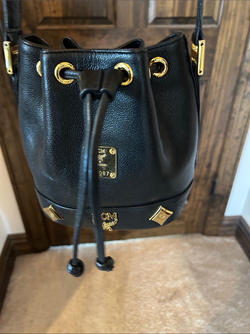 MCM Black Leather Mini Drawstring Bucket Bag with Gold Accents - Picture 6 of 14